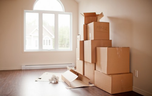 Packed moving boxes and furniture ready for transport