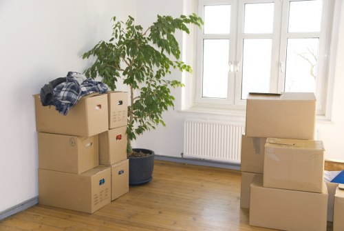 Piano removal service loading a secured instrument for transport across Kingston