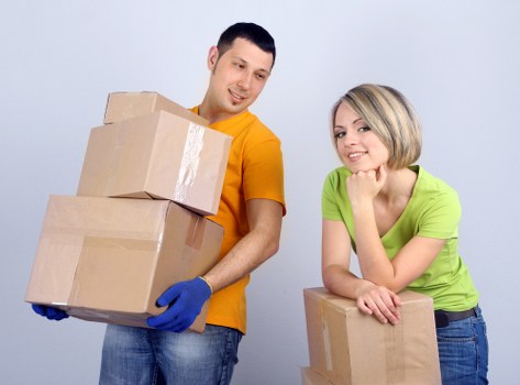 Local movers preparing boxes and household items for transport in Kingston