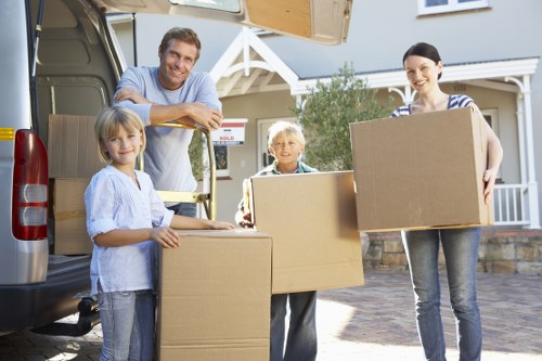 Mover lifting a box with correct manual handling technique