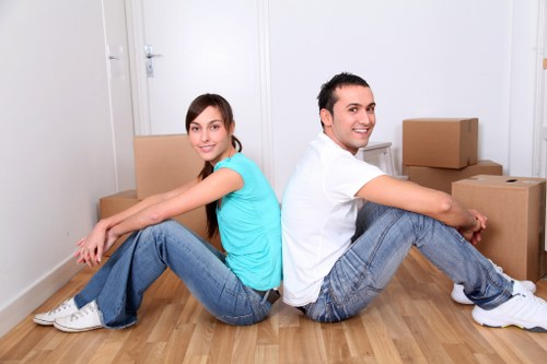 Moving crew transporting household items from a Kingston apartment