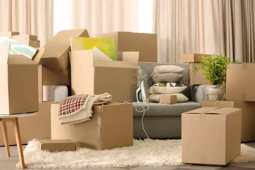 Boxes, files, and workplace items organised for transport during a Kingston business relocation
