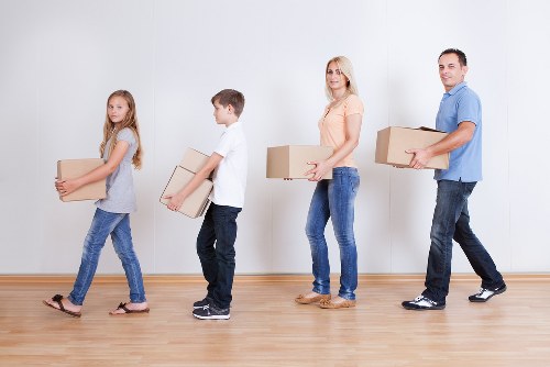 Residential moving van loading furniture for a Kingston property